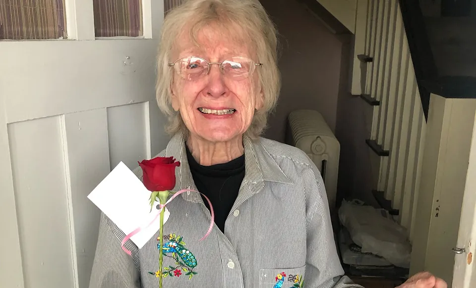 A Natrona County Meals on Wheels Recipient meets a volunteer at the door